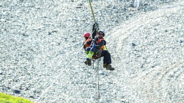 Equal parts engineer, rigger, and alpinist, building a tram requires rarified skills by workers. Here, a team from Garaventa, the Swiss subsidiary of Doppelmayr that specializes in aerial trams, feeds a pilot line forthe track rope. “That is Cedric and Christoph Hohenegger pulling the pilot rope for the 2nd track rope manually,” says Big Sky Resort’s Construction Project Manager Jas Raczynski. “We were not able to pull the pilot line with the helicopter due to scheduling conflicts that day, but these dudes wanted to stay on schedule.”